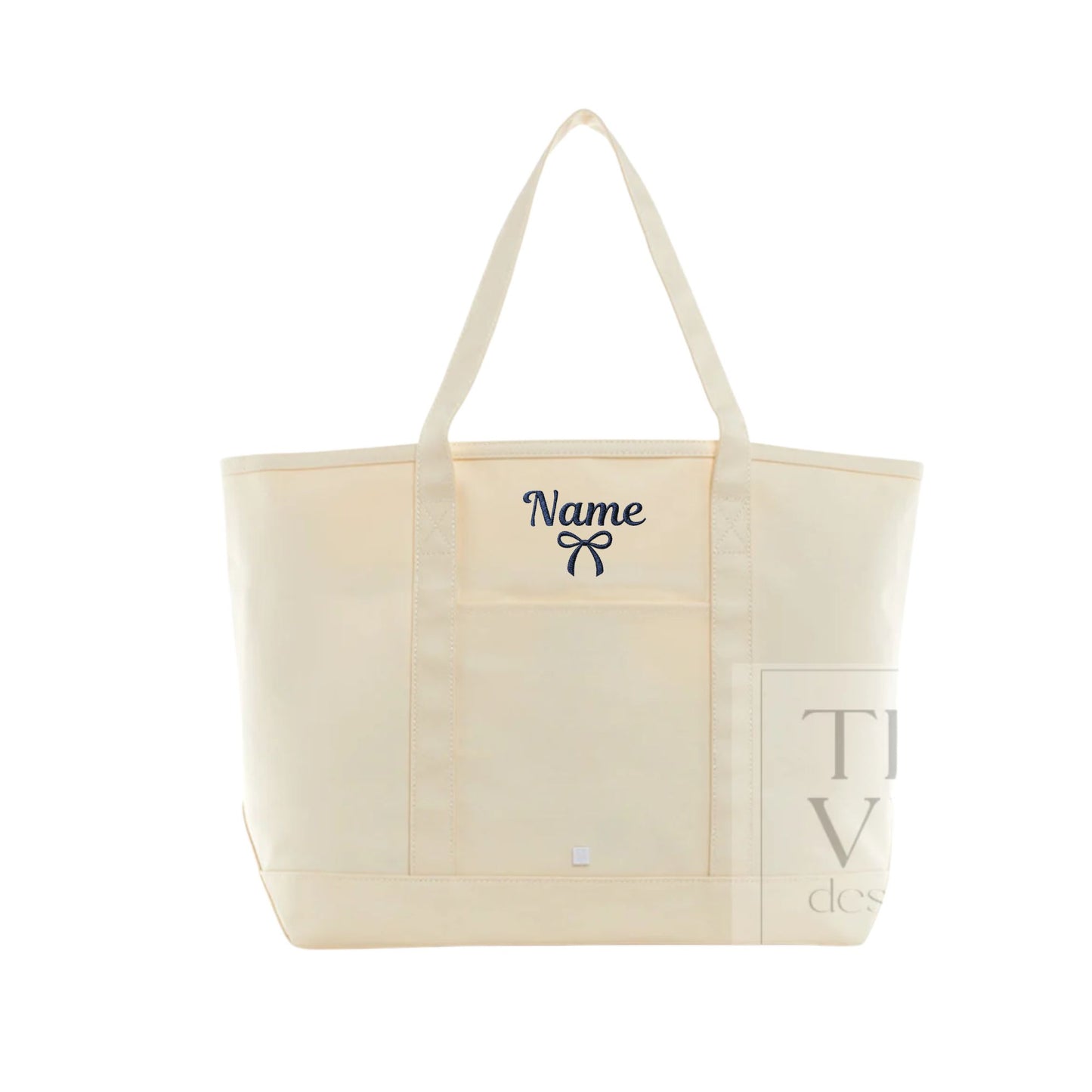 An off-white canvas tote bag with two shoulder straps, featuring a navy blue embroidered 'Name' and bow on the front pocket, and a translucent side pocket with a gray graphic.