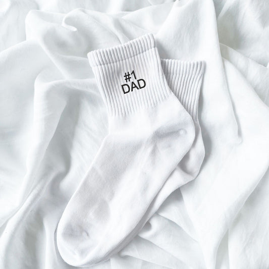 white crew socks with custom #1 dad embroidery in black thread