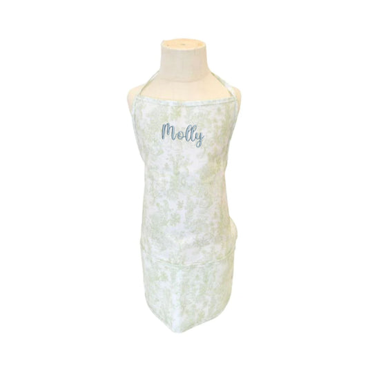 Bunny toile green kids apron with custom name embroidery in jelly font and powder blue thread