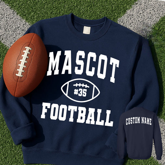 front and back image of a navy blue sweatshirt with custom mascot, player number, and custom name printed design in white. sweatshirt is laying on football green