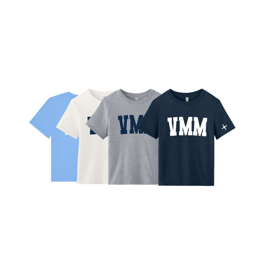 Four short-sleeve VMM graphic t-shirts in light blue, off-white, heather gray, and navy blue, arranged in a row against a solid white background.