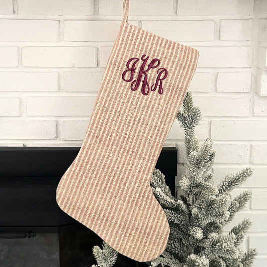 blush, natural, and gold striped stocking with custom monogram embroidered in font 3 and burgundy thread