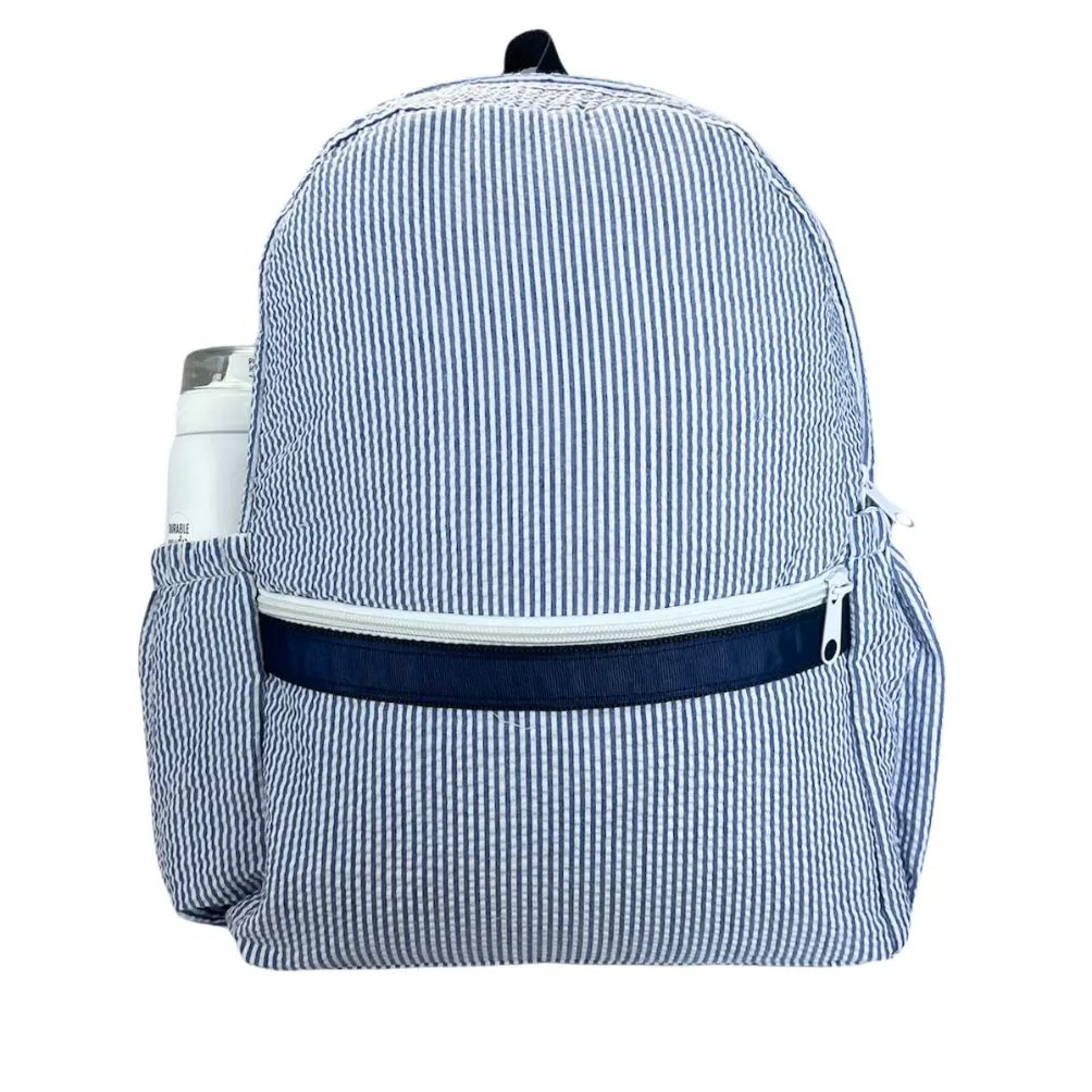 navy and white seersucker kids backpack with front zippered pocket and side water bottle pocket