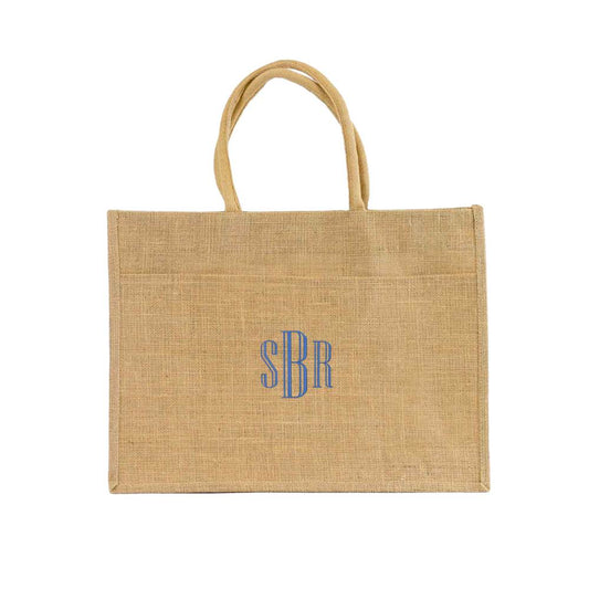 natural jute pocket tote with a custom monogram embroidered in fontn 16 and royal blue thread