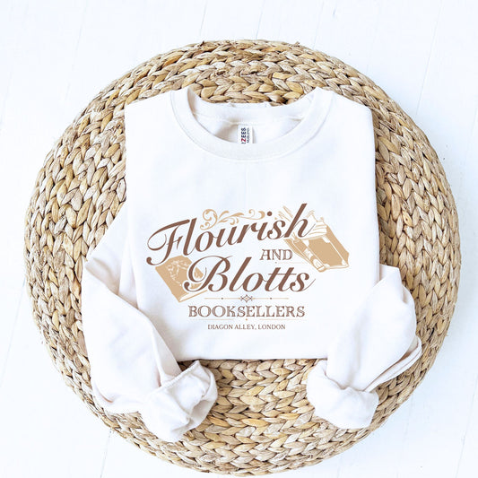 white crewneck sweatshirt with a flourish and blotts booksellers print
