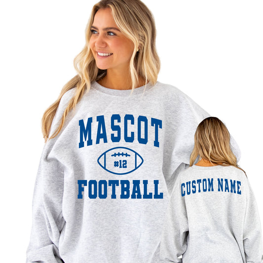 girl wearing an ash crewneck sweatshirt with custom front and back print. the front features a large mascot, football, football number, and football text on the front and "custom name" printed in blue