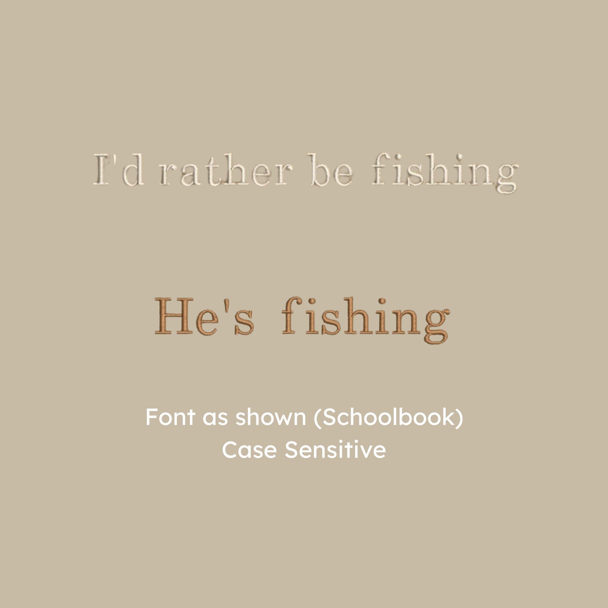 detail photo of a "I'd rather be fishing" and "he's fishing" design in schoolbook font and natural/chestnut thread