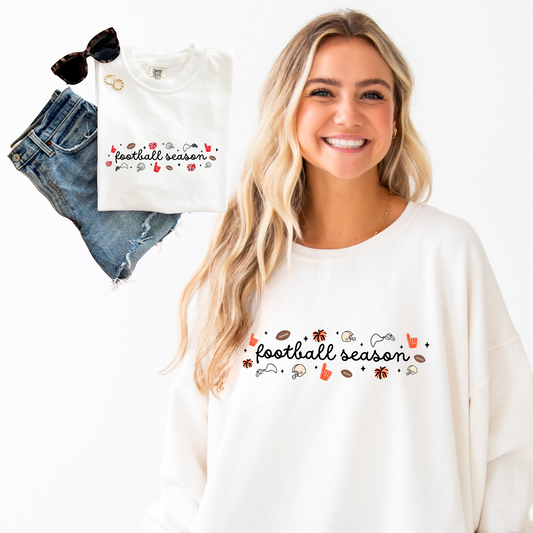 Woman wearing a white sweatshirt with 'football season' text, next to jeans and a t-shirt with similar design.