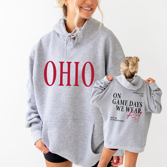 Two people wearing gray hoodies with text, one displaying 'OHIO' and the other with a message about game days.