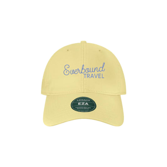 Yellow cap with 'Everbound Travel' text on a white background