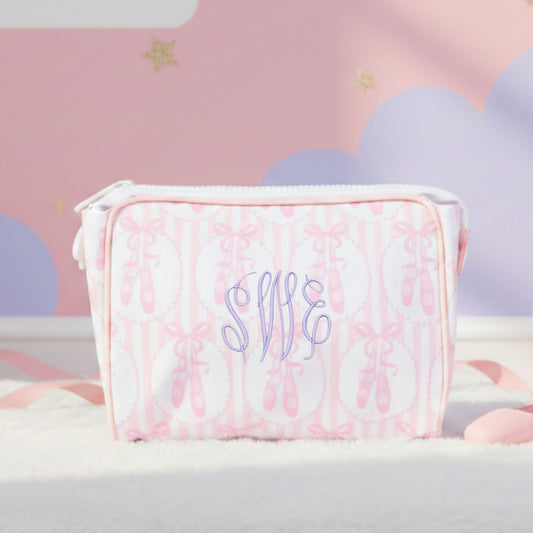 Pink ballet slipper pouch with 'swe' monogram on a soft pink background