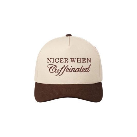 A brown two tone canvas trucker hat featuring a mixed text font embroidered design reading nicer when caffeinated