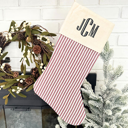 natural and red striped stocking with a custom embroidery in black thread and font 16