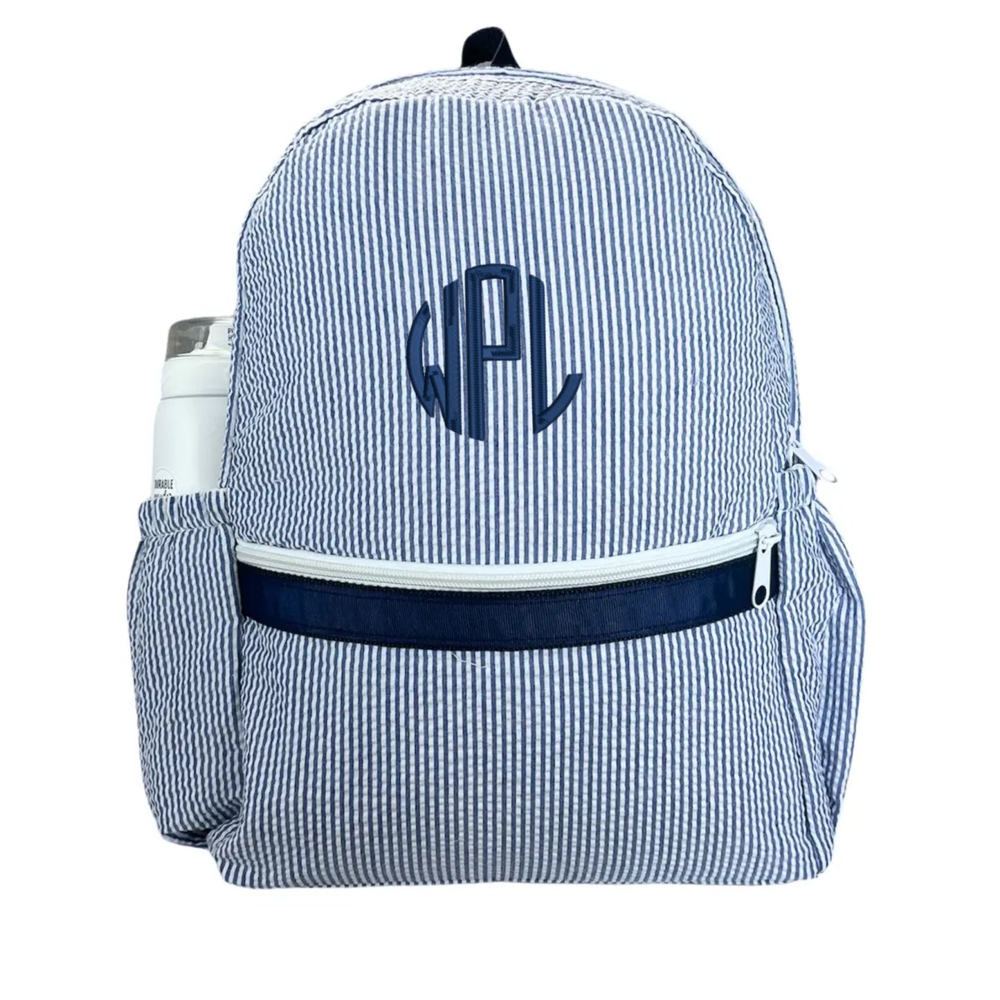 navy and white seersucker kids backpack with front zippered pocket and side water bottle pocket
