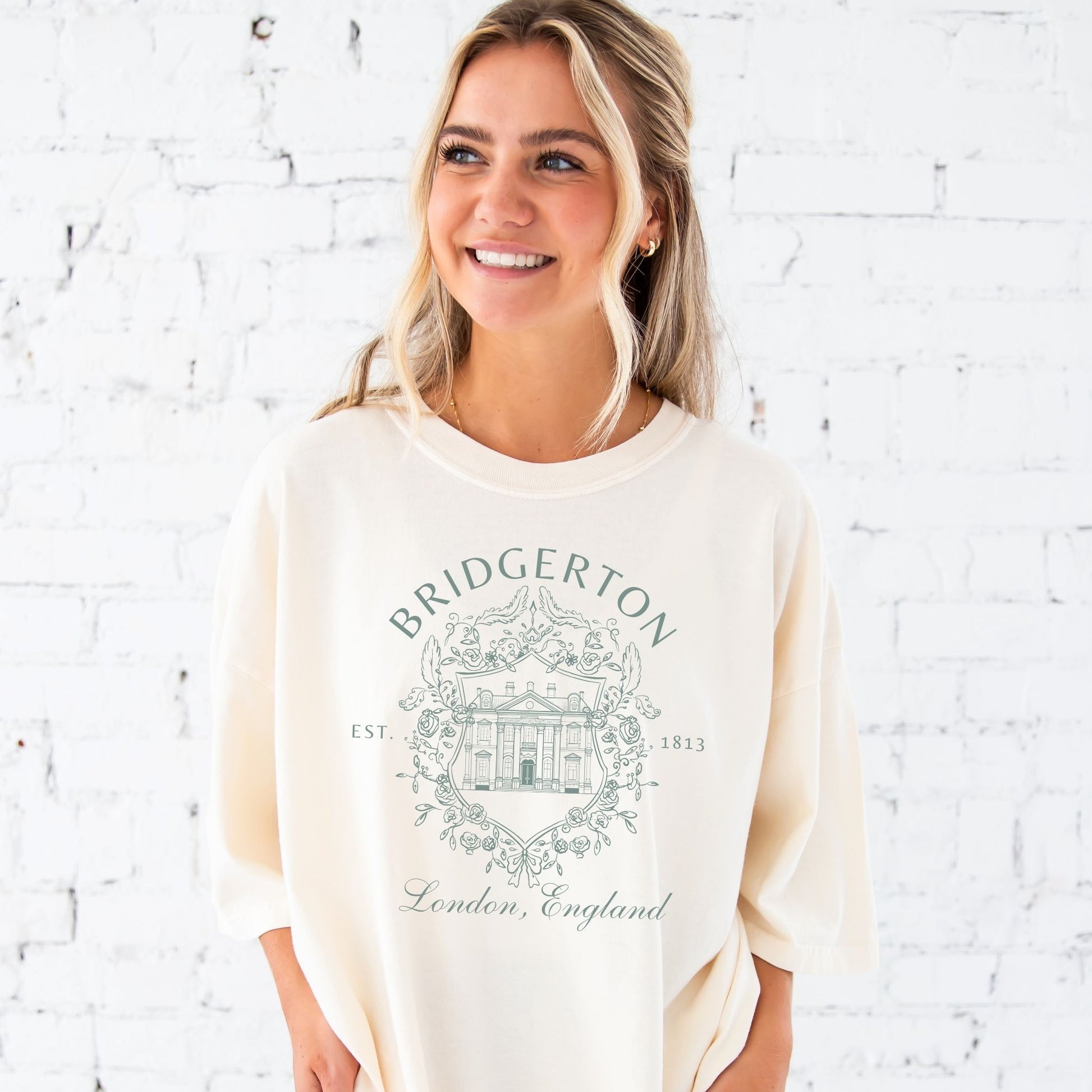 Jada is wearing a large ivory tee with the eucalyptus bridgerton print
