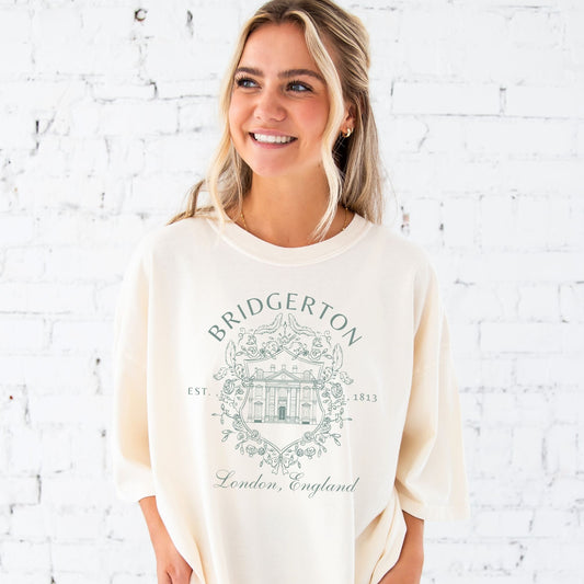 Jada is wearing a large ivory tee with the eucalyptus bridgerton print