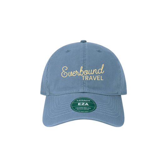 Blue cap with 'Everbound Travel' text on a white background