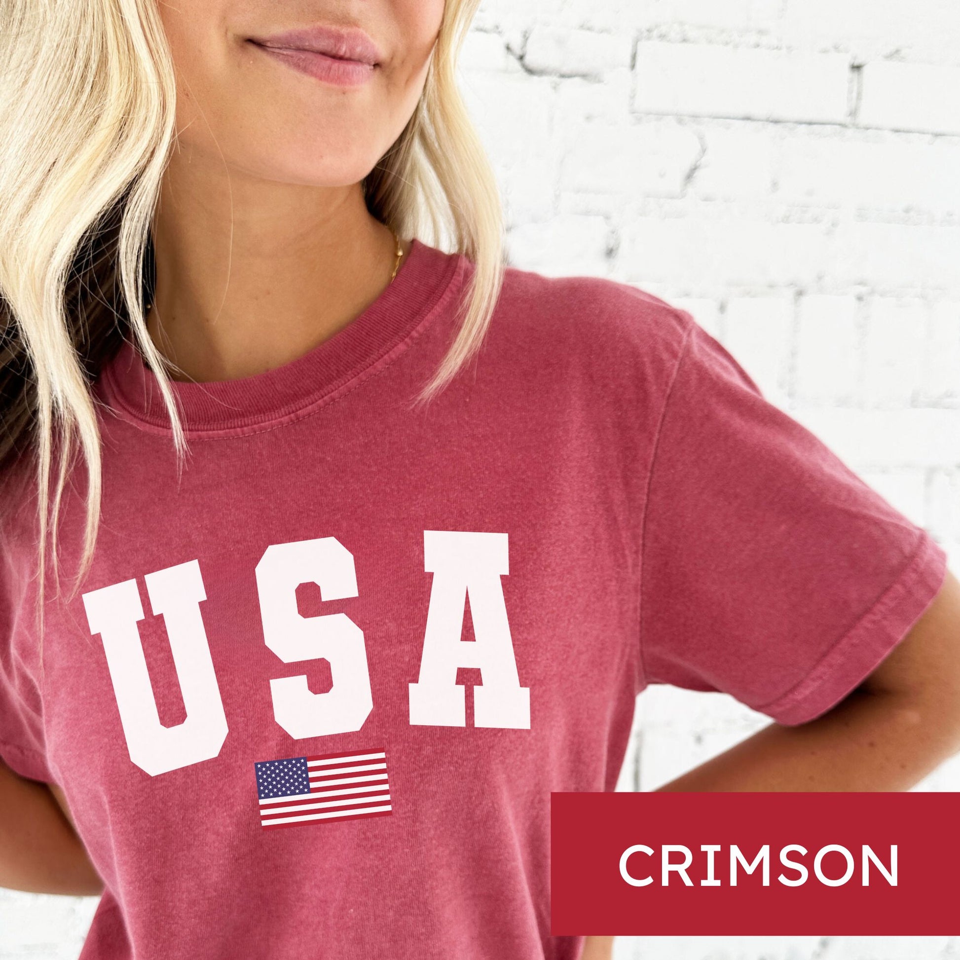 woman wearing a crimson comfort colors t-shirt with usa american flag printed design