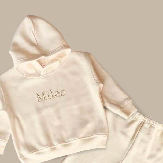 natural toddler hooded sweatshirt and jogger set with custom name embroidered in schoolbook font and camel thread