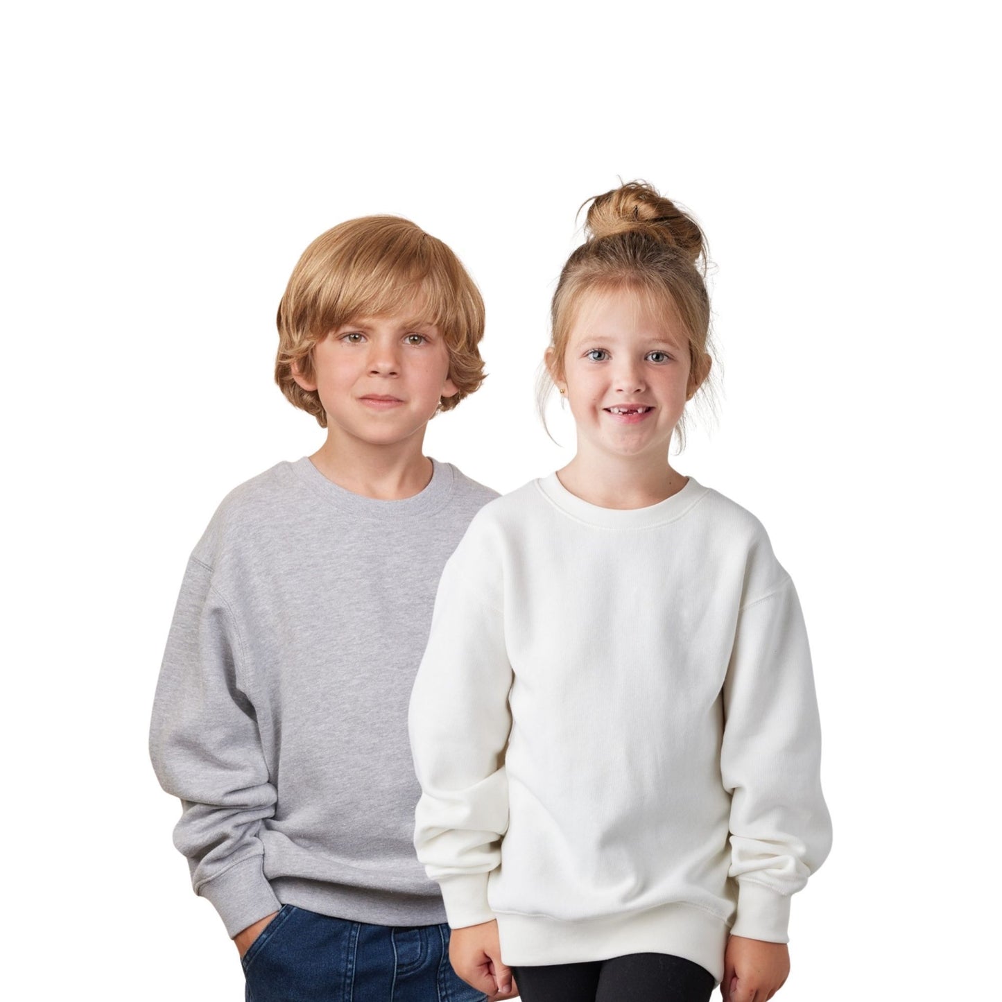 Two children wearing gray and white sweatshirts on a white background