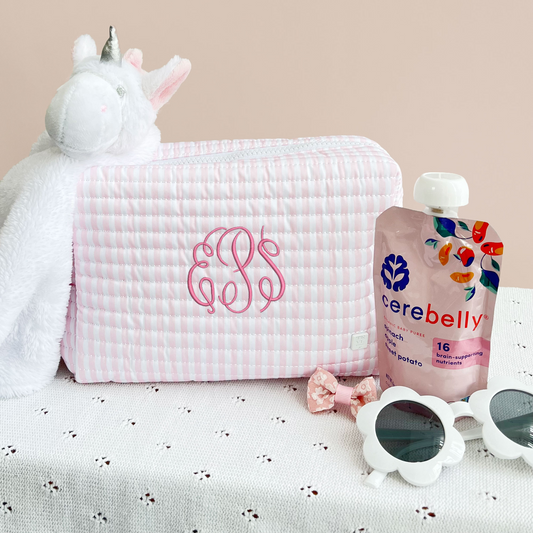 pink and white striped quilted travel pouch with font 9 embroidery in pink thread