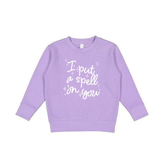 Lavender toddler crewneck sweatshirt with a playful i put a spell on you wavy script and sparkle print