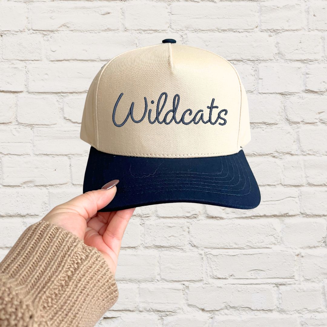 two toned canvas and navy hat with Wildcats embroidered text in navy thread