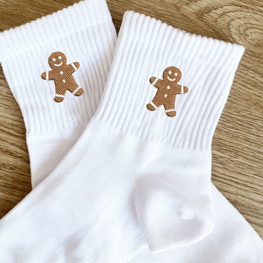 white crew socks with embroidered gingerbread man design