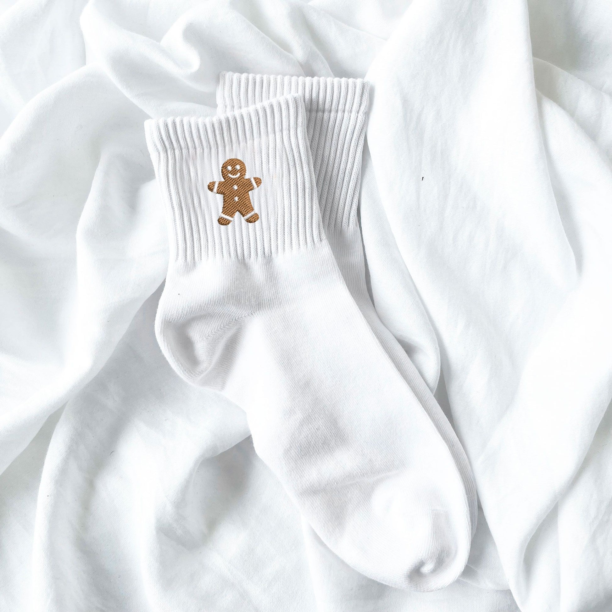 white crew socks with embroidered gingerbread man design