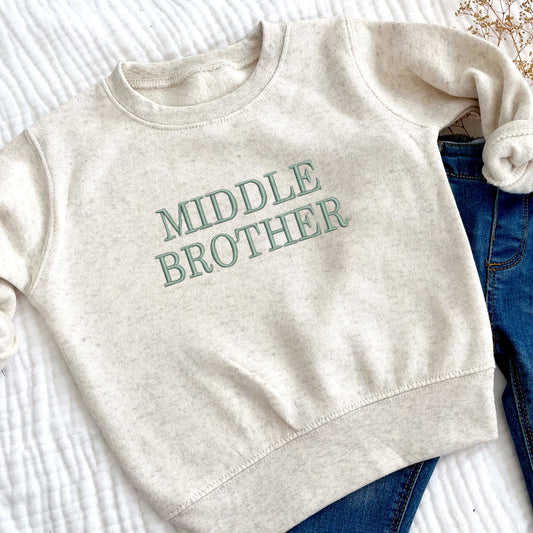 natural heather toddler crew with MIDDLE BROTHER embroidered on the center chest in eucalyptus thread.