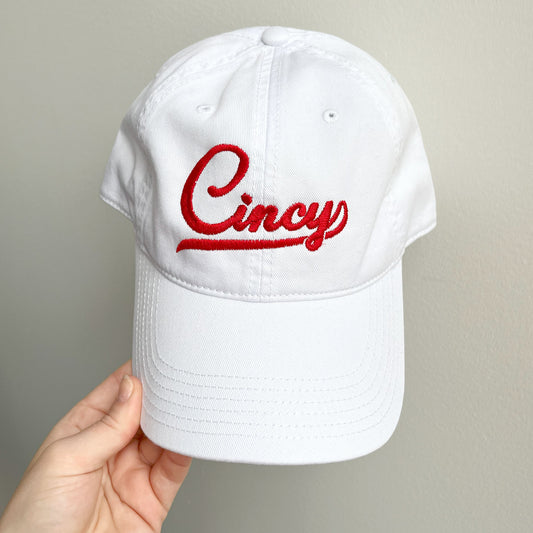 white baseball hat with embroidered Cincy design un red thread
