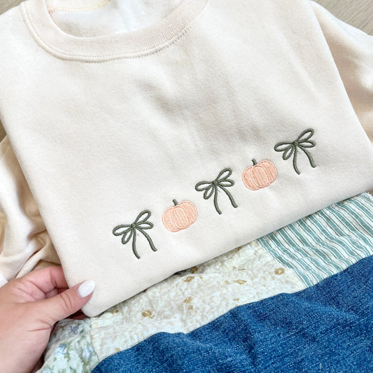 Sweet Cream sweatshirt with embroidered pumpkins and bows