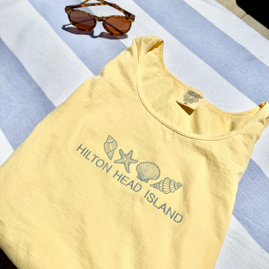 butter comfort colors tank top with custom seashell location embroidery on the center chest