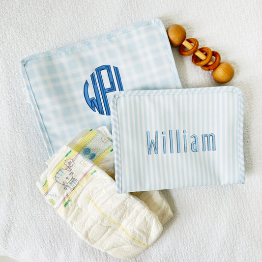 blue plaid and blue stripe travel pouches with custom name and monogram embroidery in shades of blue