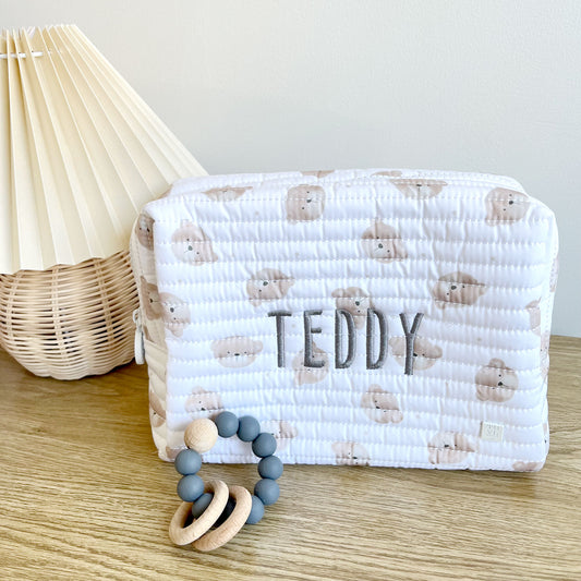 quilted children's everyday pouch with a teddy bear quilted fabric with gray thread name embroidery on the center