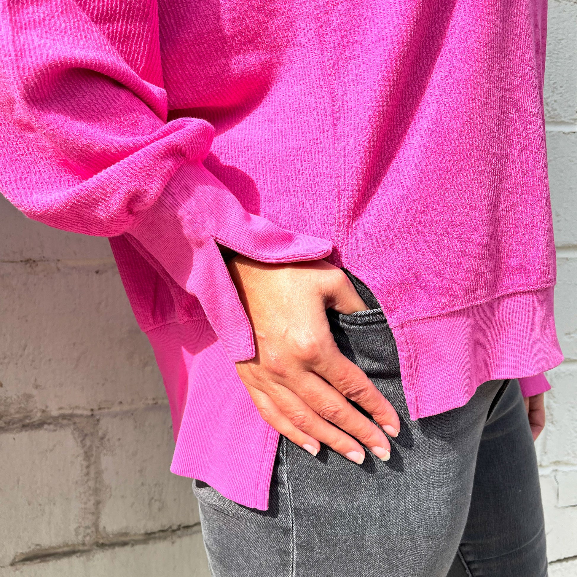 close up of the split hem and cuff on the ribbed pinkberry crewneck sweatshirt