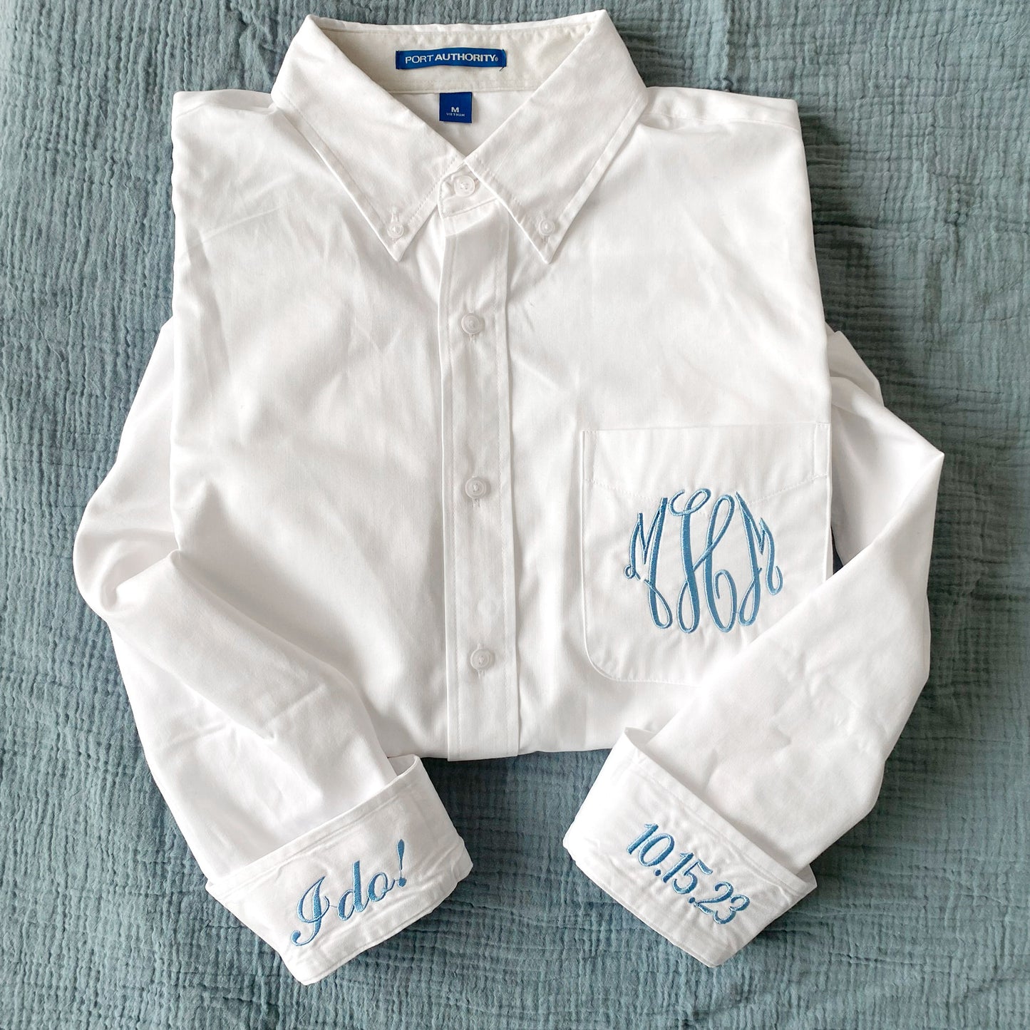 white button down with monogram and cuff embroidery in baby blue thread