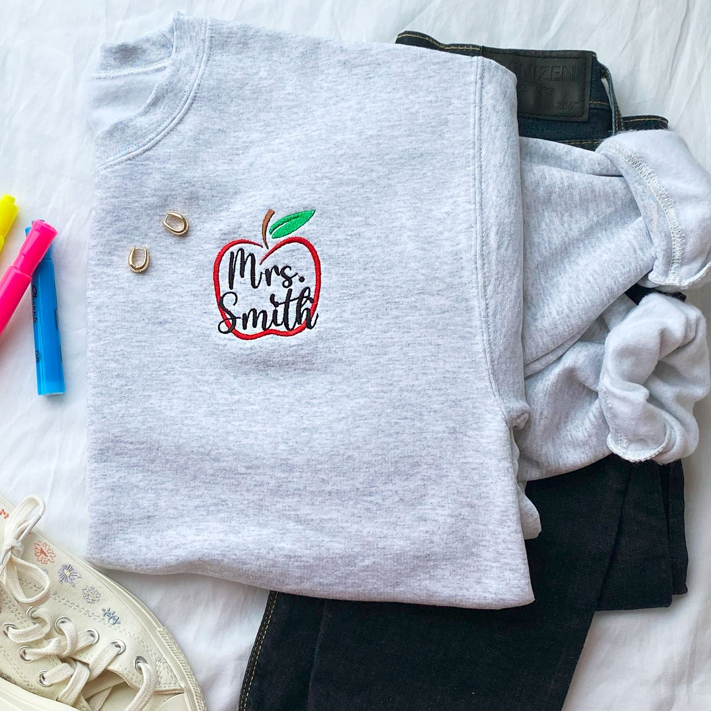 Ash crewneck sweatshirt with apple outline and custom name embroidered design