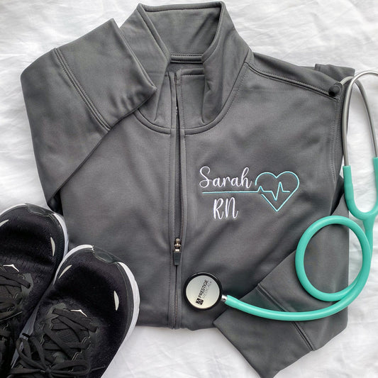 grey polyester fleece full zip jacket with custom medical design and name embroidery