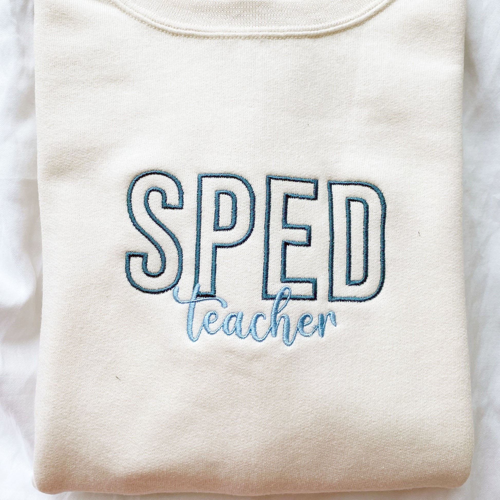 crewneck sweatshirt for teacher with SPED embroidered on the center chest