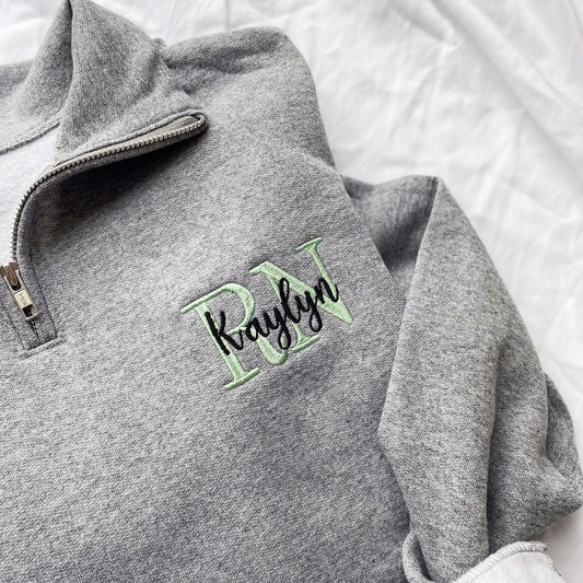 Oxford quarter zip with custom embroidered credentials on the left chest layered with a name