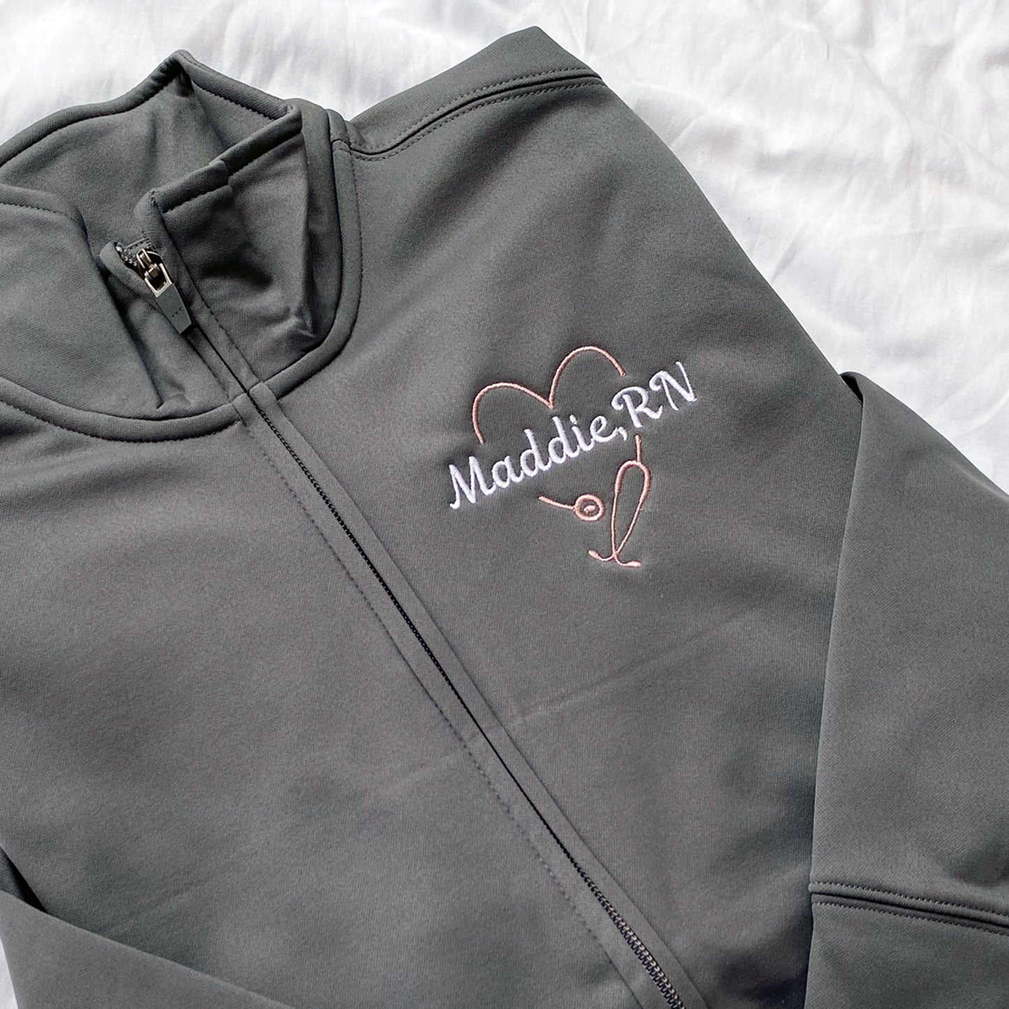 grey full zip with heart shaped embroidered design