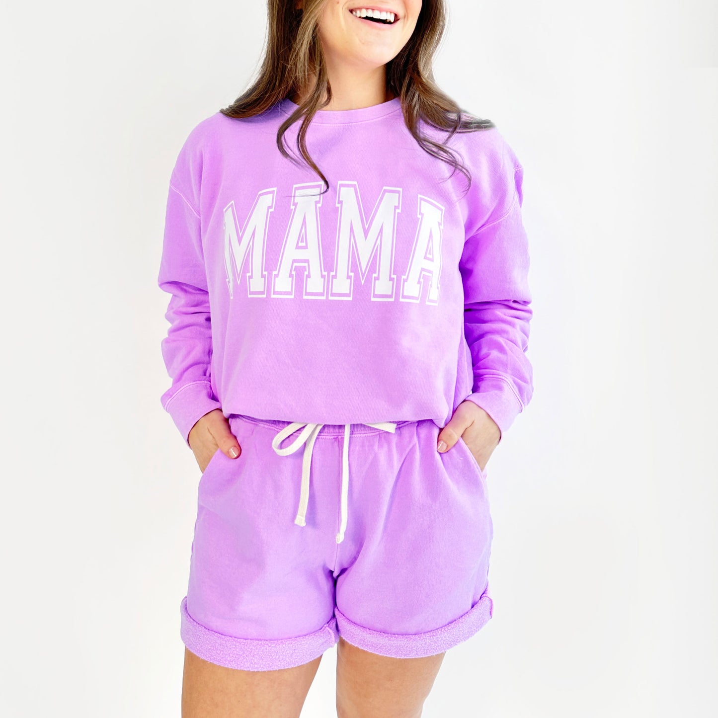 girl wearing a shorts lounge set in a neon violet with a custom large mama print