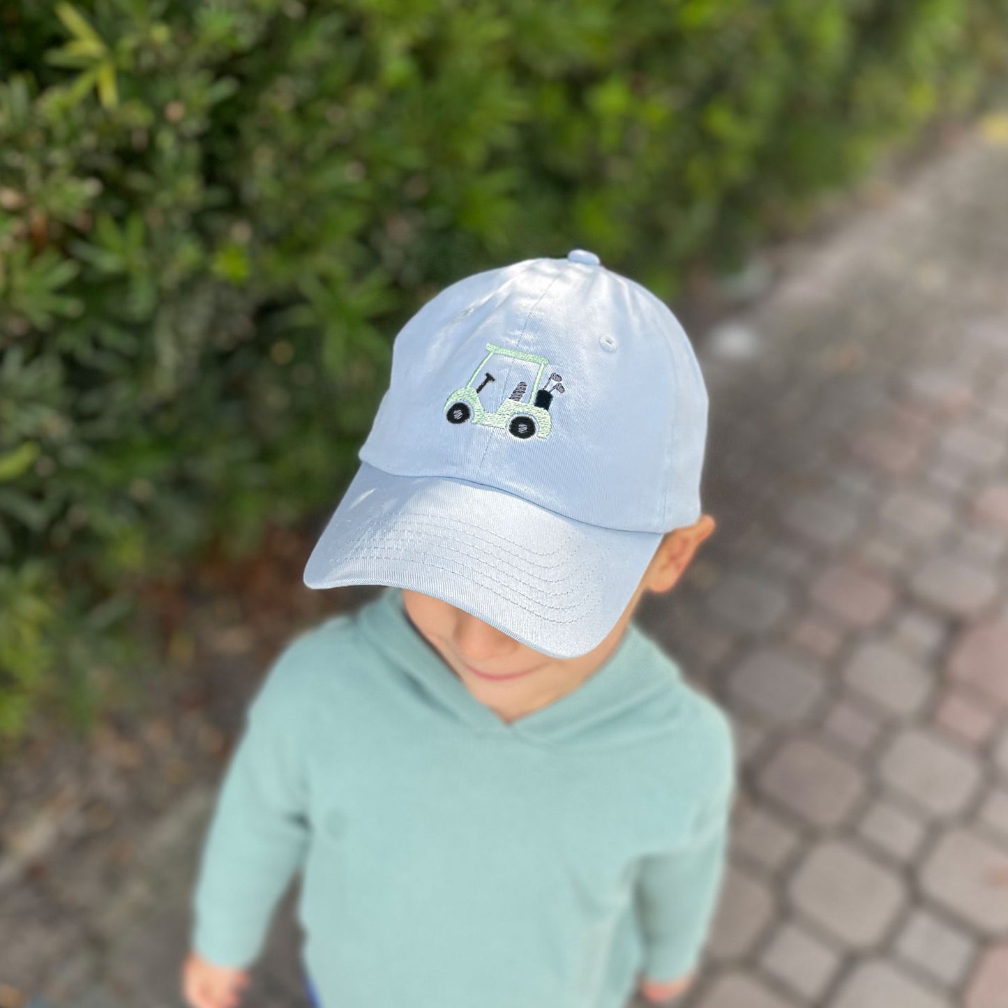 kids baby blue baseball hat with mini embroidered gold cart design