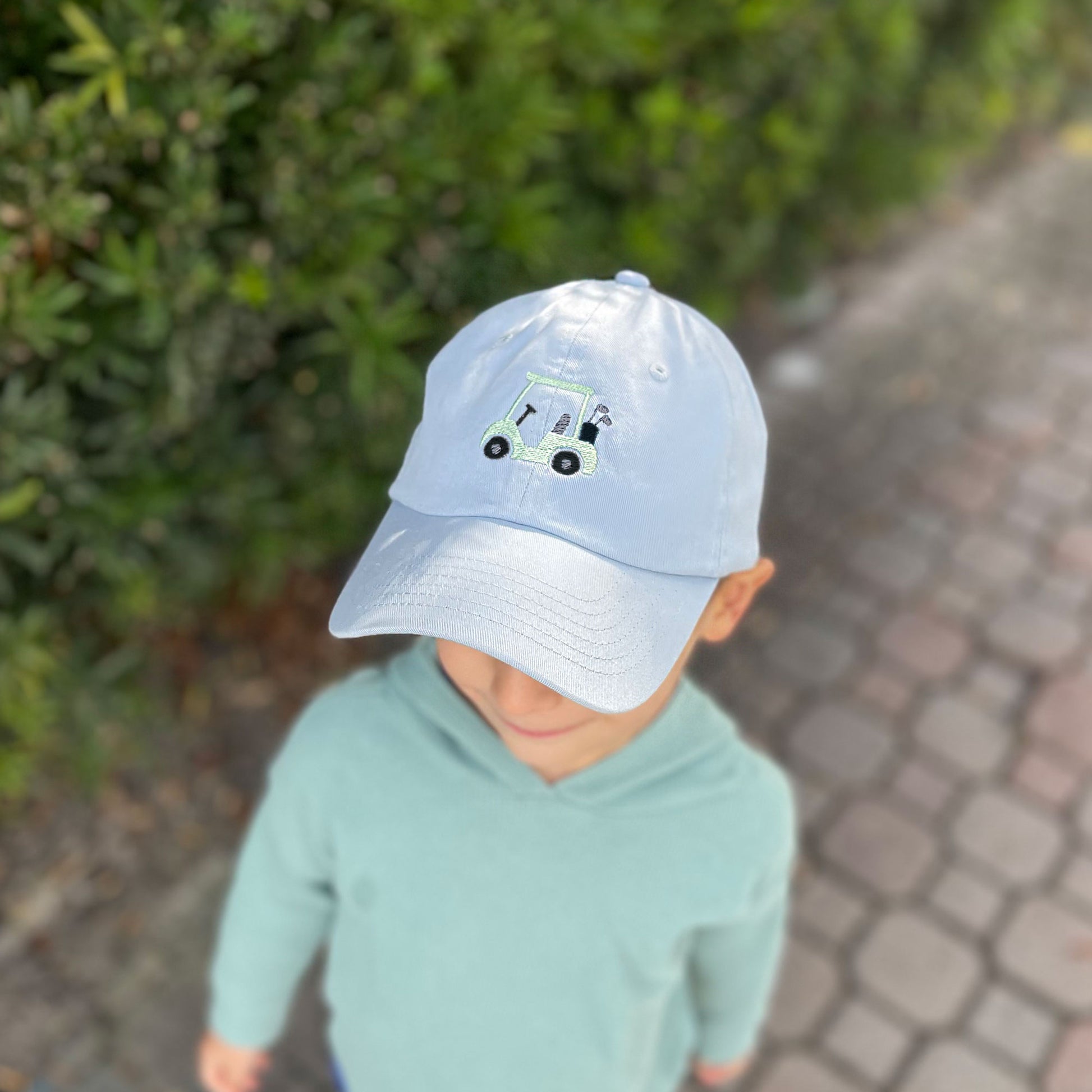 kids baby blue baseball hat with mini embroidered gold cart design