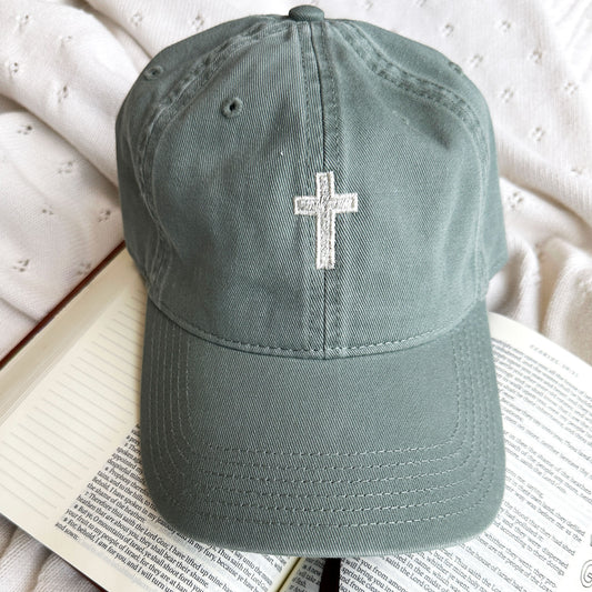 Sawgrass Green Baseball hat with mini cross embroidered in the center in natural thread