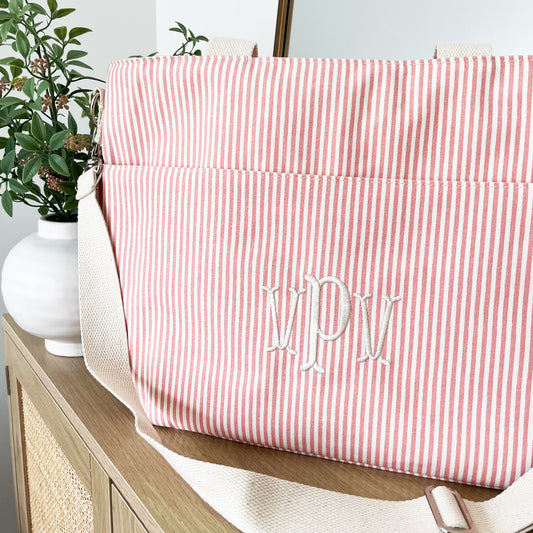 close up of an embroidered striped monogrammed lunch bag