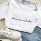 outfit layout featuring sneakers, jeans, and a white t-shirt with a cute choose to include printed design