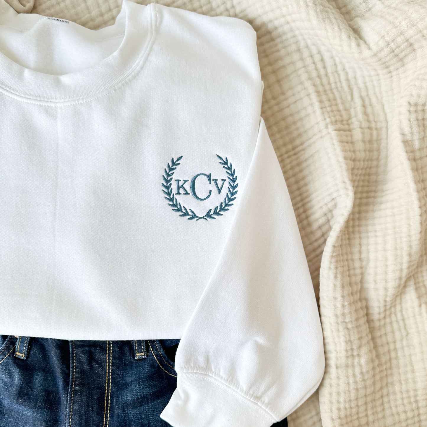 white sweatshirt with custom preppy laurel monogrammed embroidery design