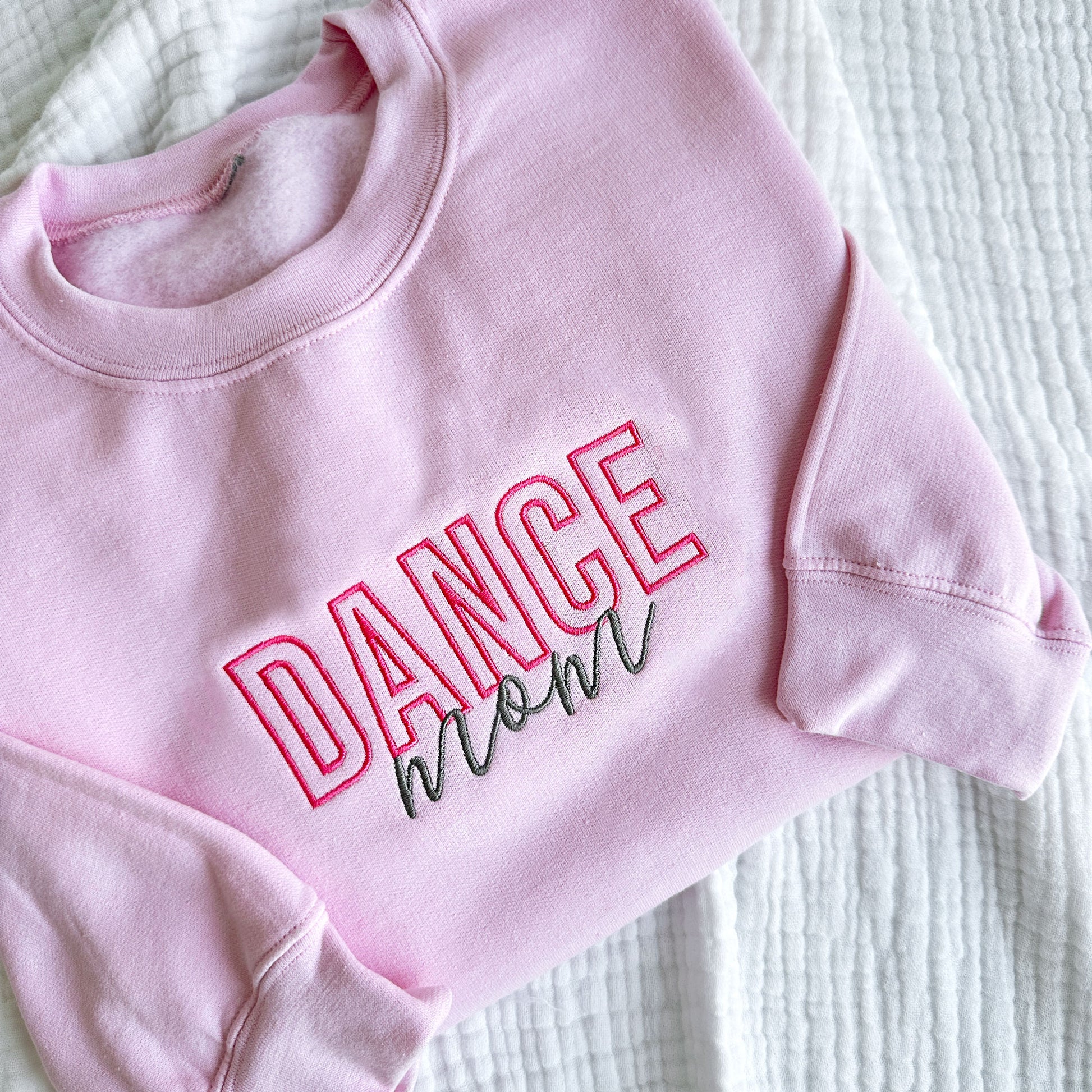Light Pink crewneck sweatshirt with embroidered dance mom design in pink and grey threads